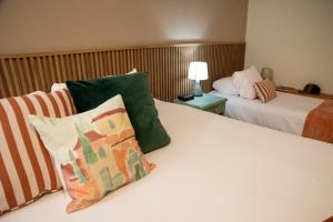 Letto o letti in una camera di Lima Atelier Boutique