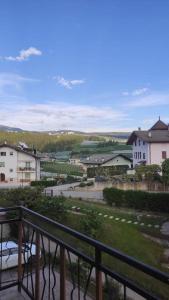 a view of a city from a balcony at Appartamento vacanza Coredo Trentino in Coredo +7 photos