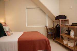 Letto o letti in una camera di Lima Atelier Boutique