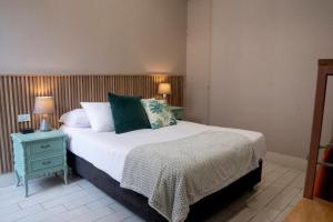 Letto o letti in una camera di Lima Atelier Boutique