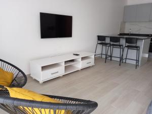 TV o dispositivi per l'intrattenimento presso Charming House Tarrafal