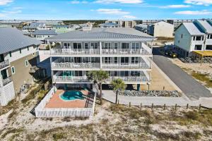 an aerial view of a large house with a swimming pool at Surfside #6 in Mexico Beach