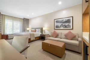a hotel room with a bed and a couch at The Lodge at Jackson Hole in Jackson