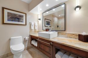 a bathroom with a sink and a mirror at The Lodge at Jackson Hole in Jackson