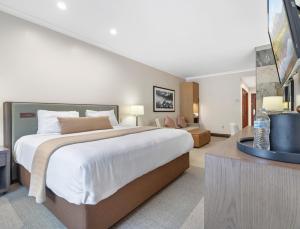 a bedroom with a large bed and a couch at The Lodge at Jackson Hole in Jackson