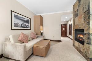 a living room with a couch and a fireplace at The Lodge at Jackson Hole in Jackson