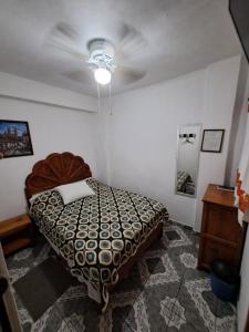 Postel nebo postele na pokoji v ubytování Hotel Las Palomitas