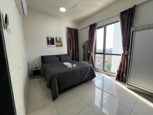 Postel nebo postele na pokoji v ubytování Da Men Studio Service Apartment