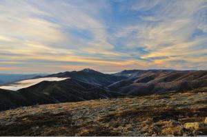 a view of a mountain under a cloudy sky at Sanki in Mount Hotham