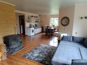 a living room with a couch and a fireplace at Nr.42 in Palanga
