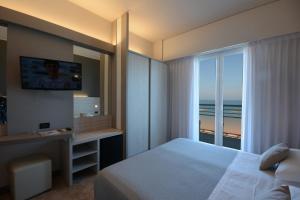 Postel nebo postele na pokoji v ubytování Hotel Spiaggia