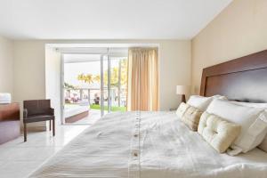 Postel nebo postele na pokoji v ubytování DEPARTAMENTO FRENTE A PLAYA EN NUEVO VALLARTA + 36 fotografií