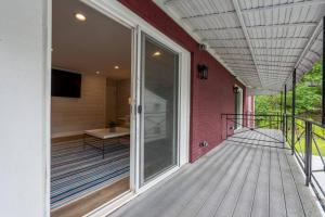 a porch of a house with a sliding glass door at Sunset Family Villa C3 in Bridgman