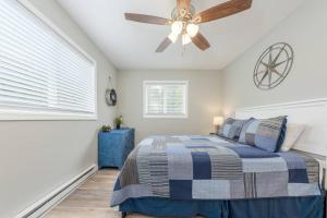 a bedroom with a bed and a ceiling fan at Sunset Villa D8 in Bridgman