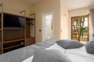 Postel nebo postele na pokoji v ubytování Boutique Hotel Paradiso