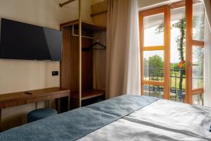 Postel nebo postele na pokoji v ubytování Boutique Hotel Paradiso