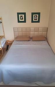 Uma cama ou camas num quarto em Apartamento com ar-condicionado