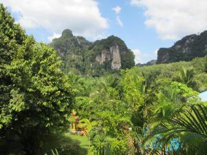 a view of the jungle with mountains in the background at Real Relax Resort in Ao Nang Beach