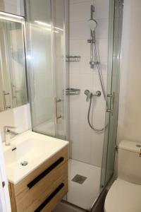 a bathroom with a shower and a sink and a toilet at Résidence Le Bois D'aurouze - Mini-studio 2 couchages MAE-8284 in Le Dévoluy