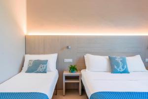 Postel nebo postele na pokoji v ubytování Hotel Altamarea
