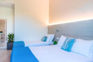 Postel nebo postele na pokoji v ubytování Hotel Altamarea