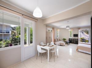 a living room with a table and chairs at Apricus1 in Apolpaina