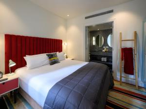Giường trong phòng chung tại Hotel DeBrett