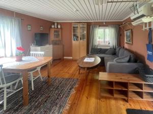 a living room with a couch and a table at 4 person holiday home in MOLKOM-By Traum in Molkom