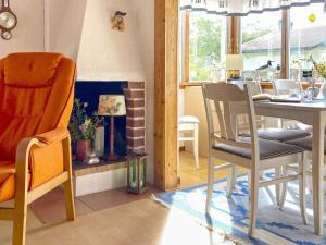 a dining room with a table and a chair at 4 person holiday home in FALKENBERG-By Traum in Falkenberg