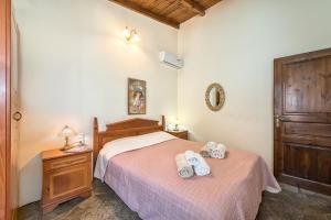 Postel nebo postele na pokoji v ubytování Yiannis Cottage