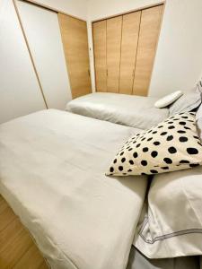 Postel nebo postele na pokoji v ubytování MA house 501