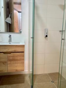 a bathroom with a shower and a sink at DF Acogedor Loft con Gym D02 in Bogotá