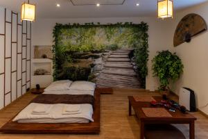 Posteľ alebo postele v izbe v ubytovaní JapanApartment - Jacuzzi