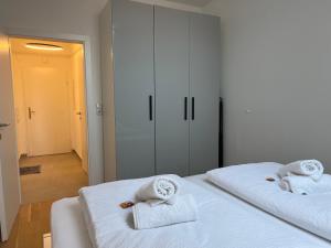 Voodi või voodid majutusasutuse "Home-Suite-Home" im historischen Zentrum von Hartberg toas