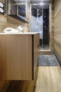 a bathroom with a sink and a shower at La Tardiere #Confort#Calme in Clermont-Ferrand +15 photos