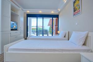 Postel nebo postele na pokoji v ubytování Villa Seaview + 19 fotografií