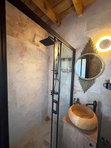 a bathroom with a sink and a mirror at Fintoz Butika in Karaburun +20 photos