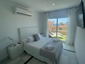Postel nebo postele na pokoji v ubytování Apartamento 3 HOME SUITES ALMERÍA