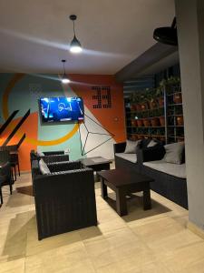 TV a/nebo společenská místnost v ubytování Villa Thirty Three