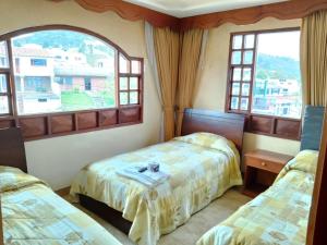 Hotel El Dorado Guatavita客房内的一张或多张床位