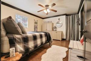 a bedroom with a bed and a ceiling fan at Hibernation Station Walkable, Wonderful, Well-lo in Shaver Lake