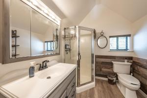 a bathroom with a sink and a shower and a toilet at Ridgeview Retreat Location Meets Comfort Ac! in Shaver Lake +46 photos