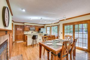 a kitchen and dining room with a table and chairs at Anderson Retreat Private Hot Tub and Kayaks! in Anderson