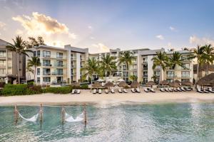 a view of the resort from the water at Dreams Cozumel Cape Resort & Spa in Cozumel