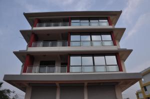 a building with balconies on top of it at Hotel Dewa Goa in Dabolim