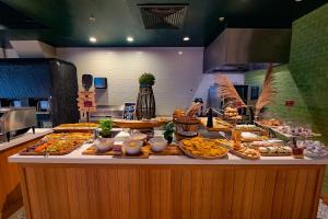 a buffet line with many different types of food at Curaçao Marriott Beach Resort in Willemstad