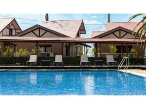 a house with a swimming pool in front of a house at Goto Conkana Kingdom - Vacation STAY 25614v in Goto +36 photos