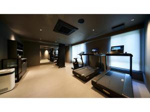 a large room with a gym with a treadmill at ROYAL CHESTER NAGASAKI hotel&retreat - Vacation STAY 30719v in Nagasaki