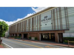 a large building on the side of a street at Hotel Flags Isahaya - Vacation STAY 25620v in Isahaya