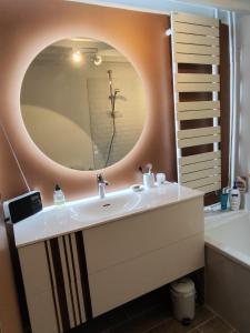 a bathroom with a sink and a mirror at Gîte Le Clos Maridor - Grande Longère Normande -15 personnes in Saint-Martin-Saint-Firmin +24 photos